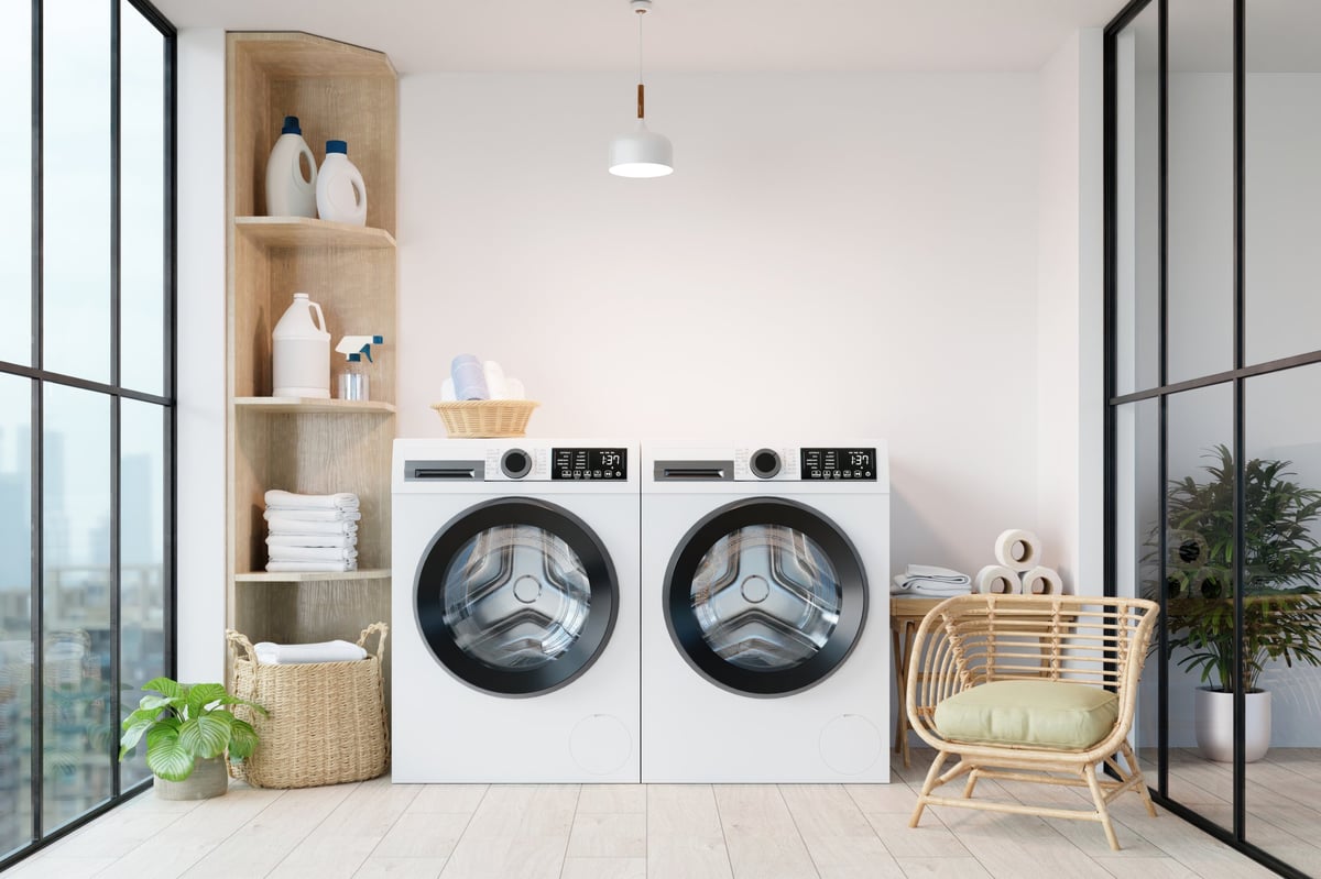 Modern laundry room with washing machines and storage